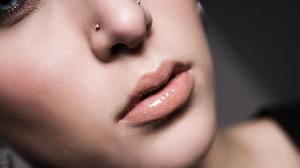 woman with two high nostril piercings