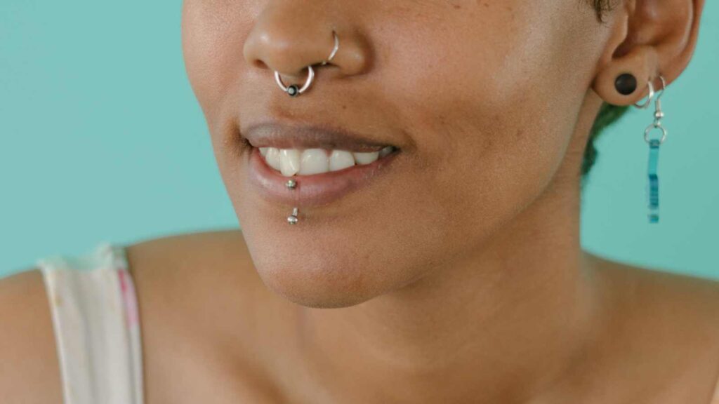which side of my nose should i pierce. Woman with multiple nose piercings